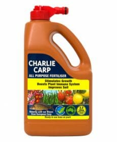 A 2.2-liter container of Charlie Carp All Purpose Liquid Fertilizer Spray Pack with a red cap, designed to stimulate growth, boost plant immune systems, and improve soil.