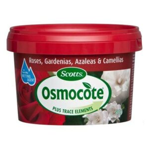 A red and green container of Osmocote Controlled Release Fertiliser: Fruit, Citrus, Trees & Shrubs 500g for roses, gardenias, azaleas, camellias, and even fruit citrus trees, with a capacity of 500g.