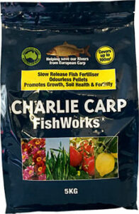 A 5kg bag of Charlie Carp FishWorks Slow Release Fertiliser Pellets, featuring images of flowers and plants, and text promoting benefits such as odorless Fertiliser Pellets, slow release, soil health, and fertility.