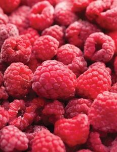 Close-up of a vibrant red pile from the Rubus 'Raspberry' 2L Pot, showcasing fresh, ripe raspberries.