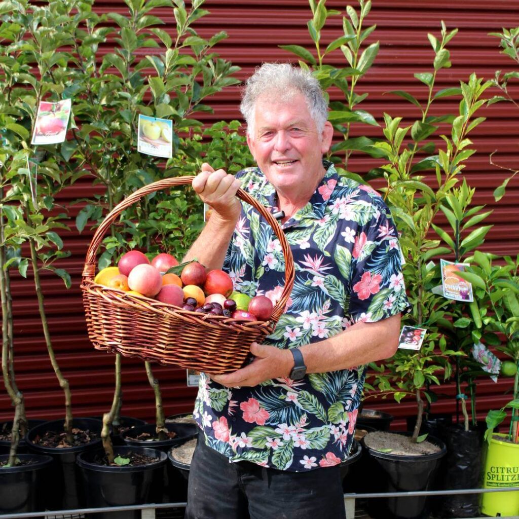 Hello Hello Plants Nursery Campbellfield Melbourne Victoria Australia Chris with basket of fruit fruit trees stock