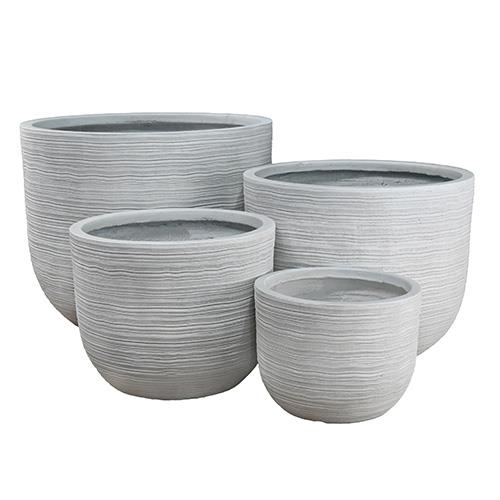 A set of our grey coloured decorative pots for feature plants rippled texture different sizes