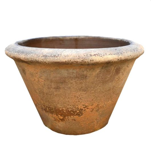 A large terra cotta planter on a white background. Terracotta squatcono planter pot orange rustic coloured for feature plants