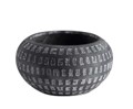 A decorative feature pot for plants in the garden or house dark grey charoal coloured with light patterns