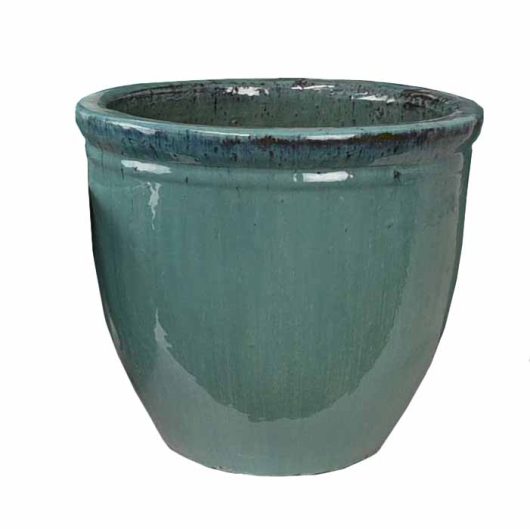 A green ceramic planter pot for gardens and feature plants