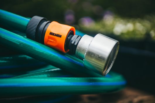 Garden Hose Complete Set with Adaptors and Shower head rosette. Blue garden plant hose with orange adaptor and silver shower watering rosette head