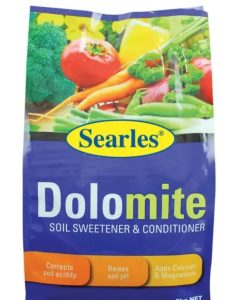 Package of Searles '5 in 1 Organic Fertiliser' 30L, displaying colorful vegetables and text about its benefits like correcting soil acidity, adding nutrients, and enhancing pyrethrum effectiveness.