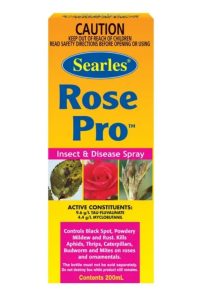 A box of Searles Rose Pro insect and disease spray, detailing active ingredients and warnings, featuring an image of roses.