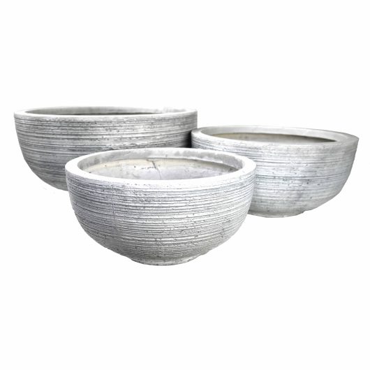 Three GeoLite Squat Egg White Wash S 23x23cm planters, each featuring a large, round grey concrete design with a textured surface, are artfully arranged on a clean white background.