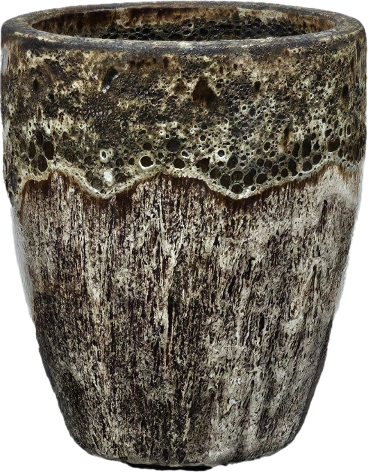 A textured brown and black ceramic cup with a rough, stone-like appearance and uneven surface.